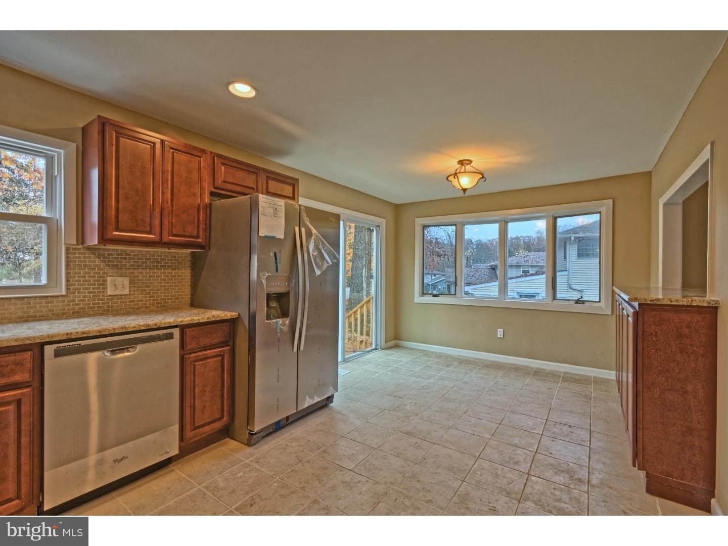 245 Winding Way Road Stratford, NJ 08084 - Photo 11 of 21 a kitchen with stainless steel appliances granite countertop a refrigerator and a stove top oven