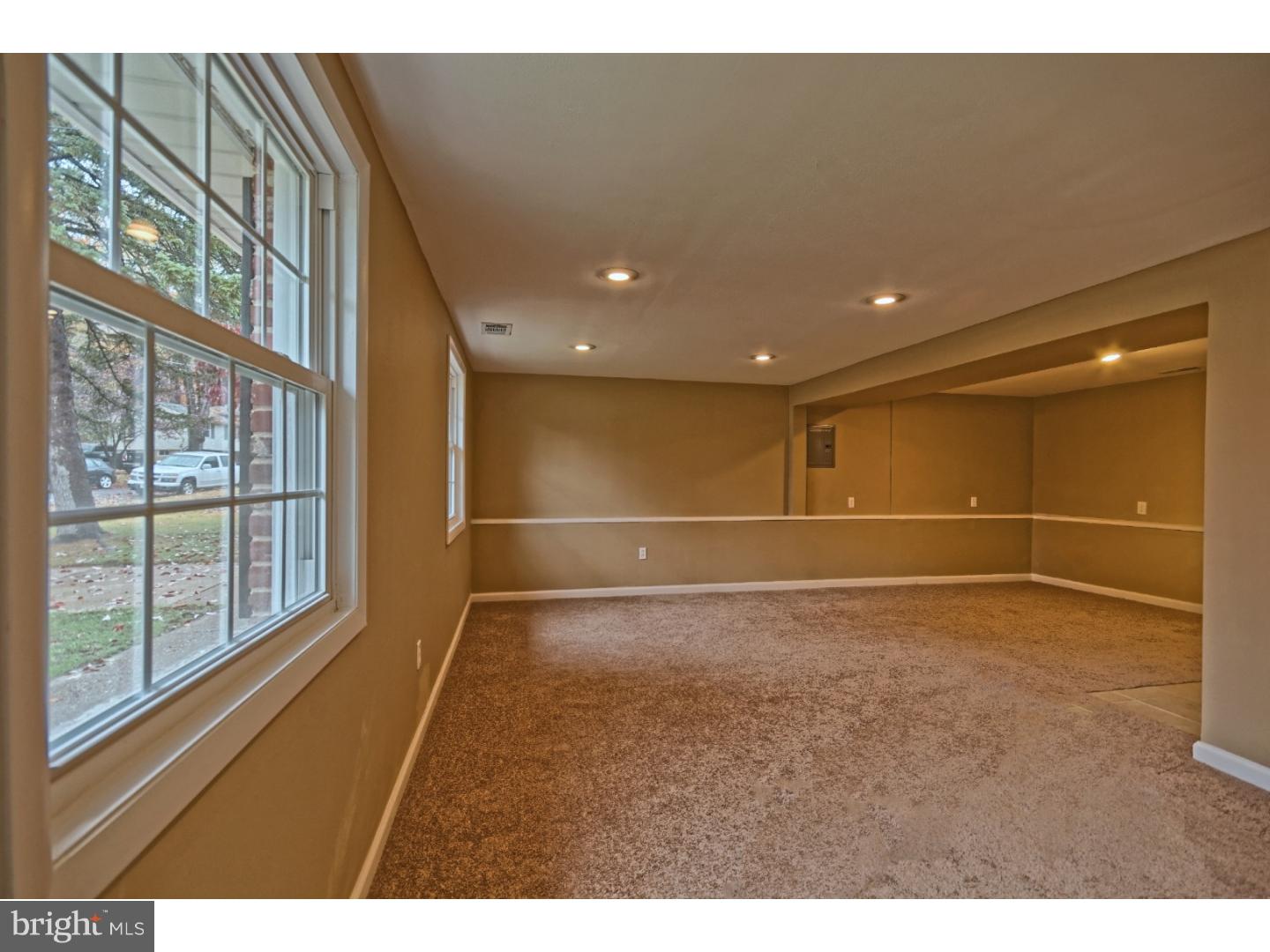 245 Winding Way Road Stratford, NJ 08084 - Photo 12 of 21 a view of an empty room with a window