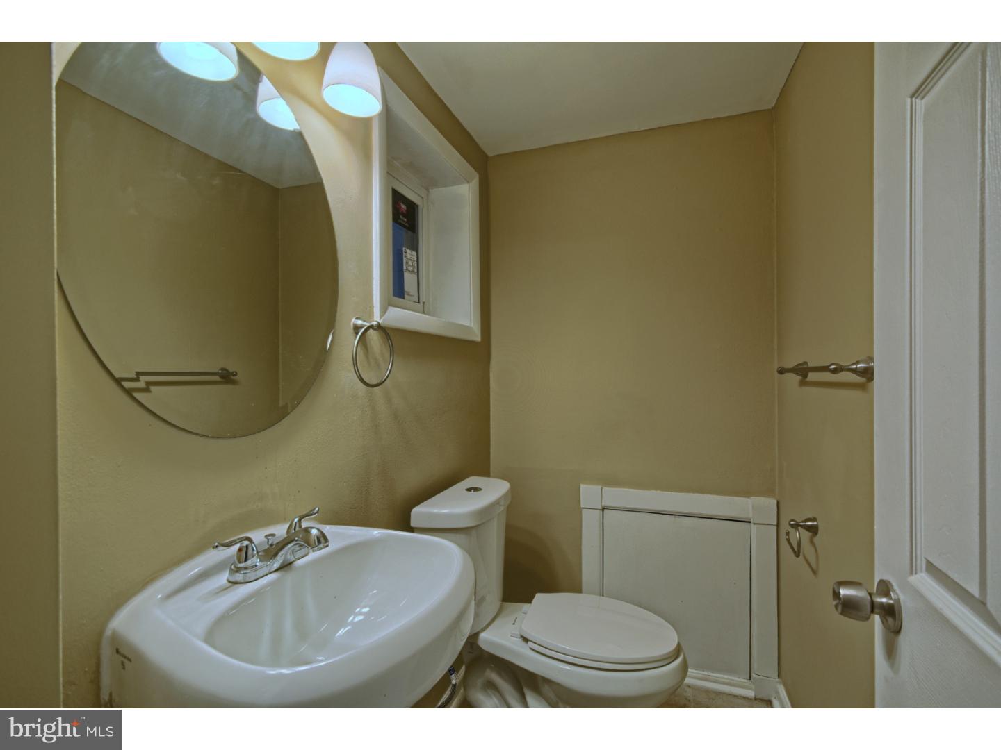 245 Winding Way Road Stratford, NJ 08084 - Photo 14 of 21 a bathroom with a sink and a mirror