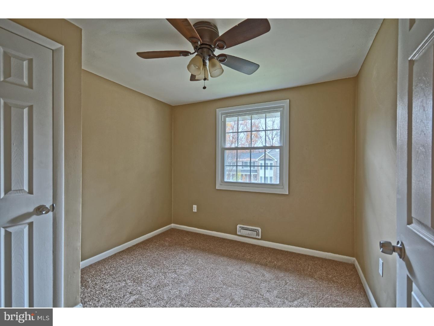 245 Winding Way Road Stratford, NJ 08084 - Photo 17 of 21 an empty room with windows and ceiling fan