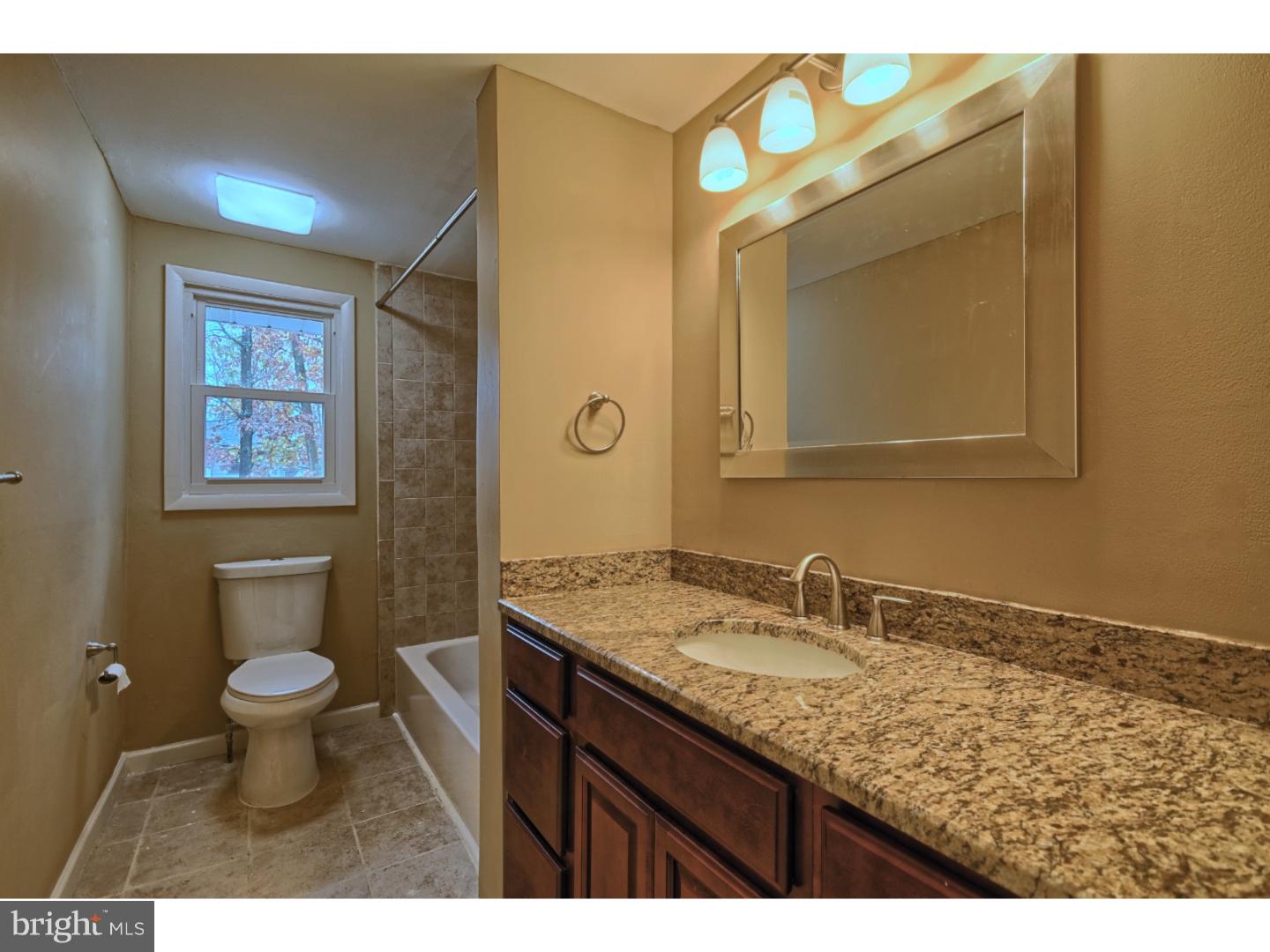 245 Winding Way Road Stratford, NJ 08084 - Photo 18 of 21 a bathroom with a granite countertop sink toilet and mirror