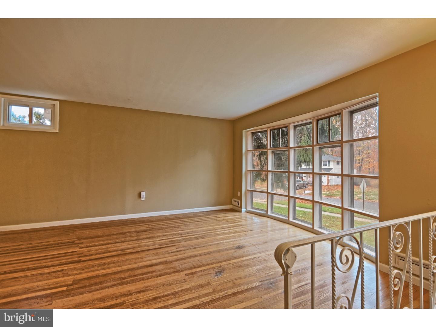 245 Winding Way Road Stratford, NJ 08084 - Photo 4 of 21 a view of an empty room and wooden floor