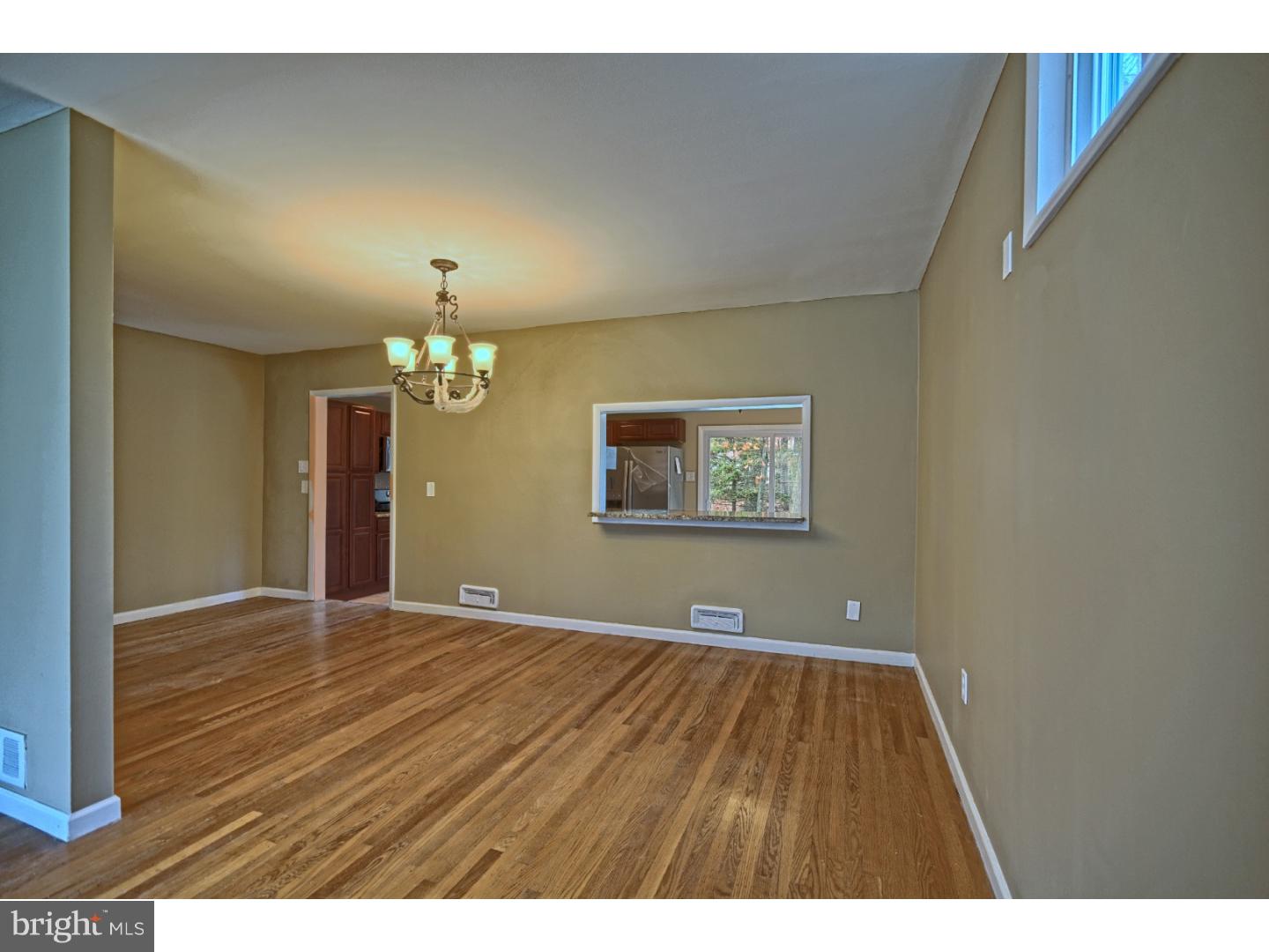 245 Winding Way Road Stratford, NJ 08084 - Photo 6 of 21 a view of an empty room with a window