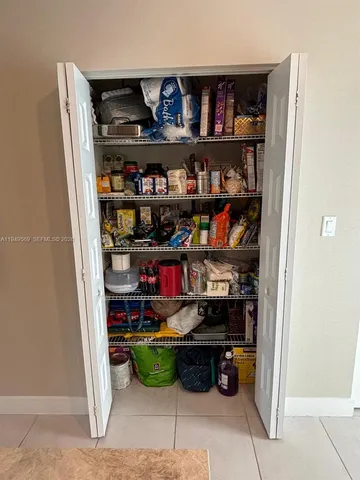 a shelf with books and knick knacks on it