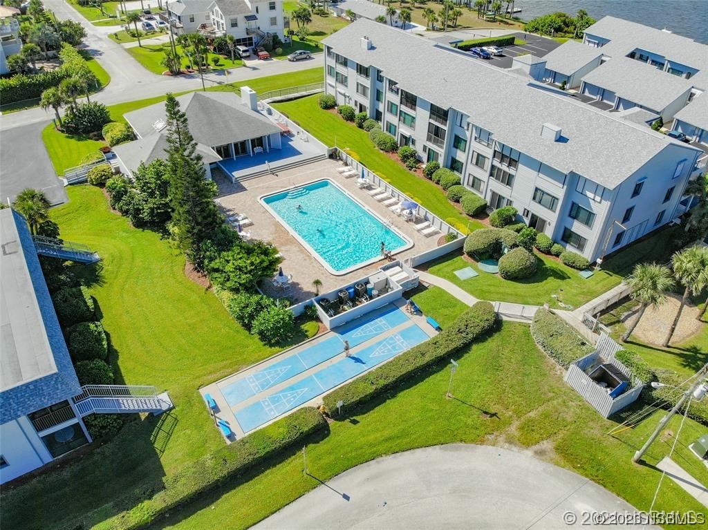 6584 Engram Road, Unit D302 New Smyrna Beach, FL 32169 - Photo 2 of 39 an aerial view of a city