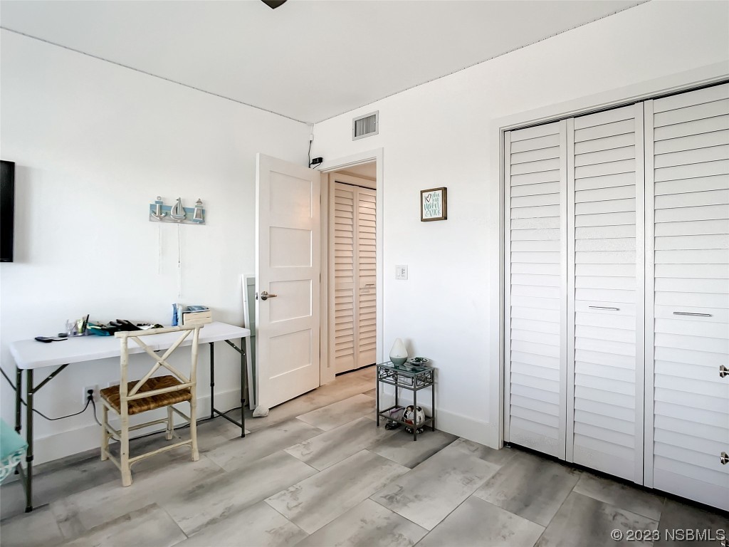 6584 Engram Road, Unit D302 New Smyrna Beach, FL 32169 - Photo 28 of 39 a view of a workspace with furniture and a window