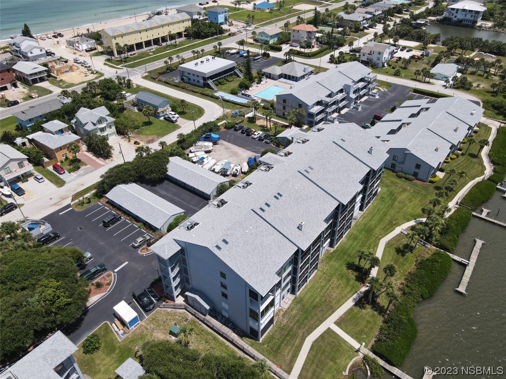 6584 Engram Road, Unit D302 New Smyrna Beach, FL 32169 - Photo 3 of 39 an aerial view of a house with a yard