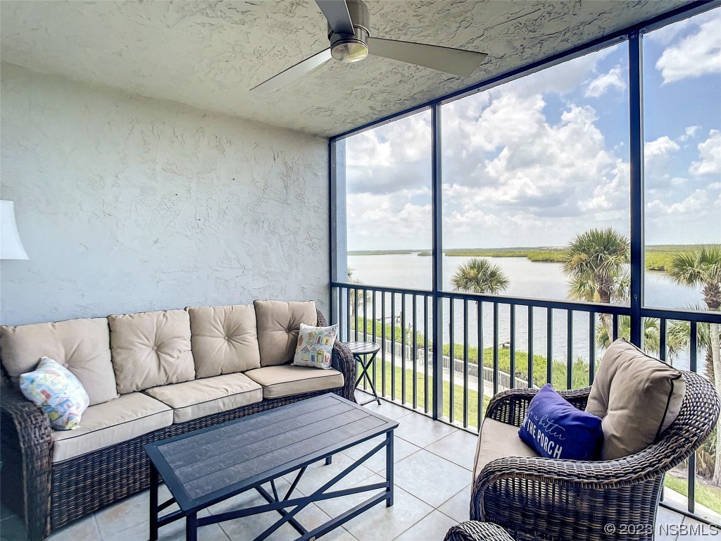 6584 Engram Road, Unit D302 New Smyrna Beach, FL 32169 - Photo 35 of 39 a living room with furniture and a window