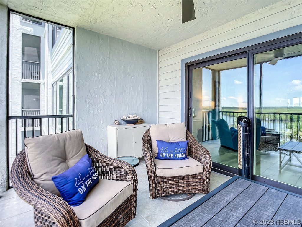 6584 Engram Road, Unit D302 New Smyrna Beach, FL 32169 - Photo 36 of 39 a living room with furniture