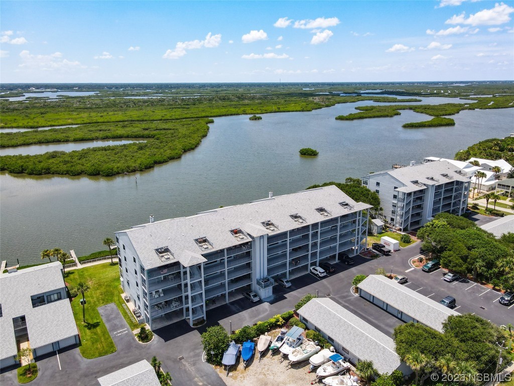 6584 Engram Road, Unit D302 New Smyrna Beach, FL 32169 - Photo 6 of 39 a view of a swimming pool with outdoor space