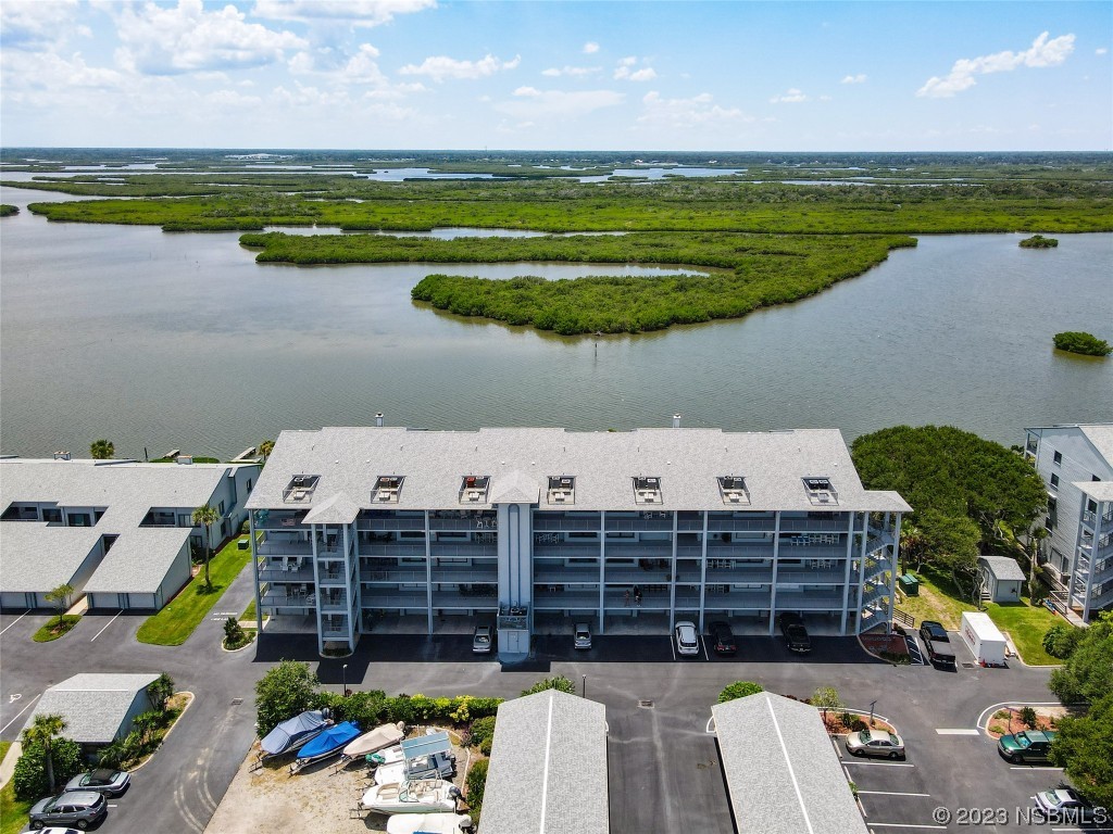 6584 Engram Road, Unit D302 New Smyrna Beach, FL 32169 - Photo 8 of 39 a view of a lake with a terrace