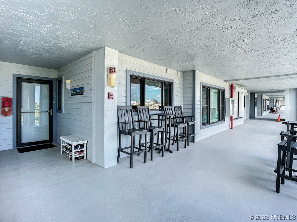 6584 Engram Road, Unit D302 New Smyrna Beach, FL 32169 - Photo 9 of 39 a living room with furniture