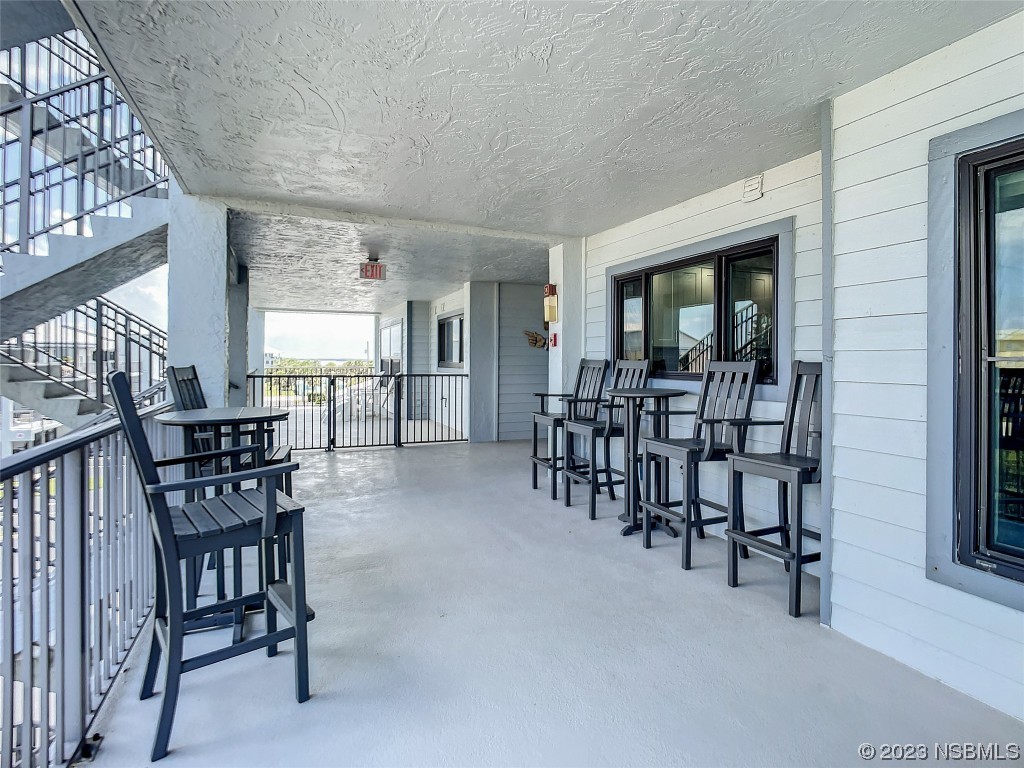 6584 Engram Road, Unit D302 New Smyrna Beach, FL 32169 - Photo 10 of 39 a view of a livingroom with furniture and window