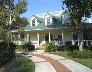 4 Middle Road Sewall's Point, FL 34996 - Photo 1 of 2 front view of a house with a yard