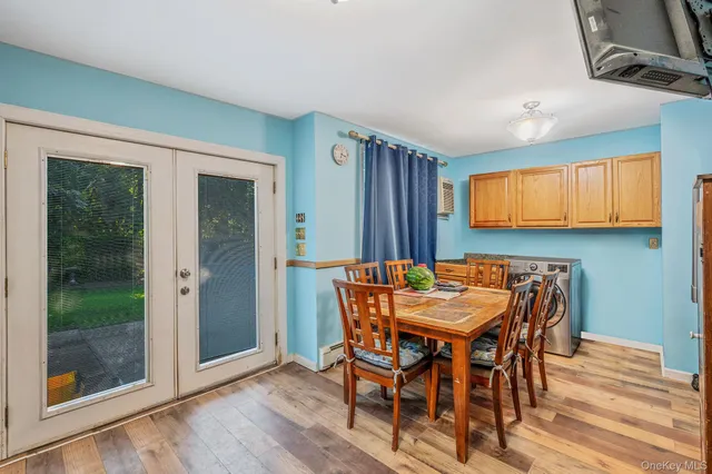 a view of a dining room with furniture and window