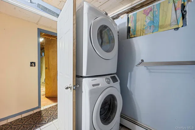 a view of a hallway with washer and dryer