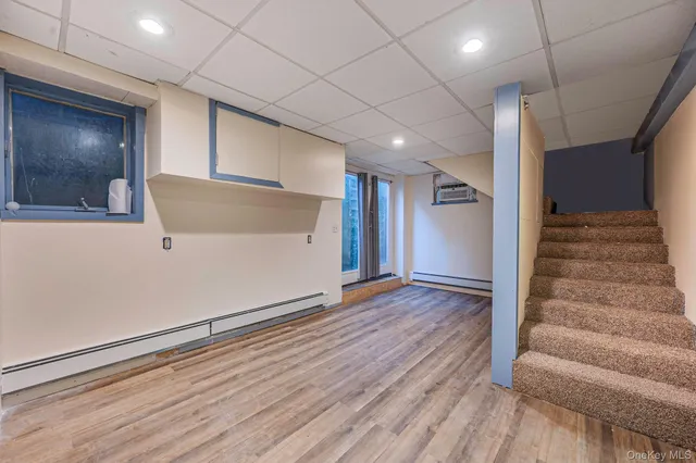 a view of an entryway with wooden floor