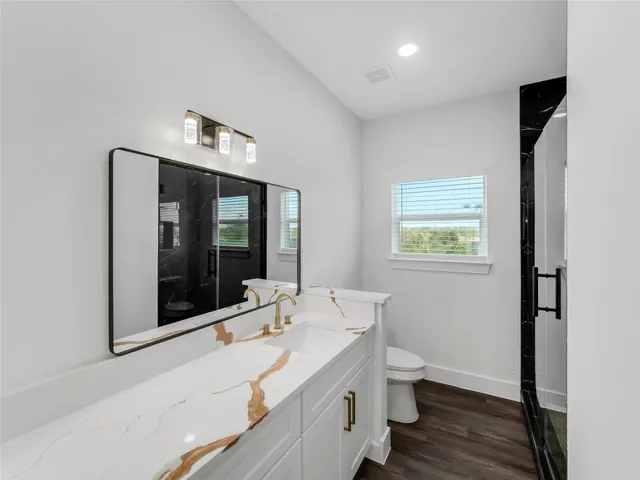 a bathroom with a sink and a large mirror