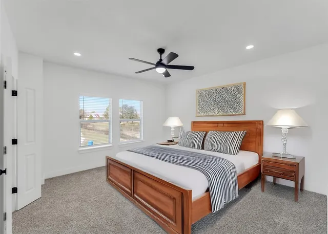 a bedroom with bed and a chandelier
