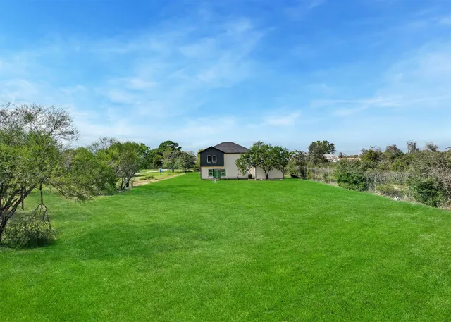 a view of a garden with houses
