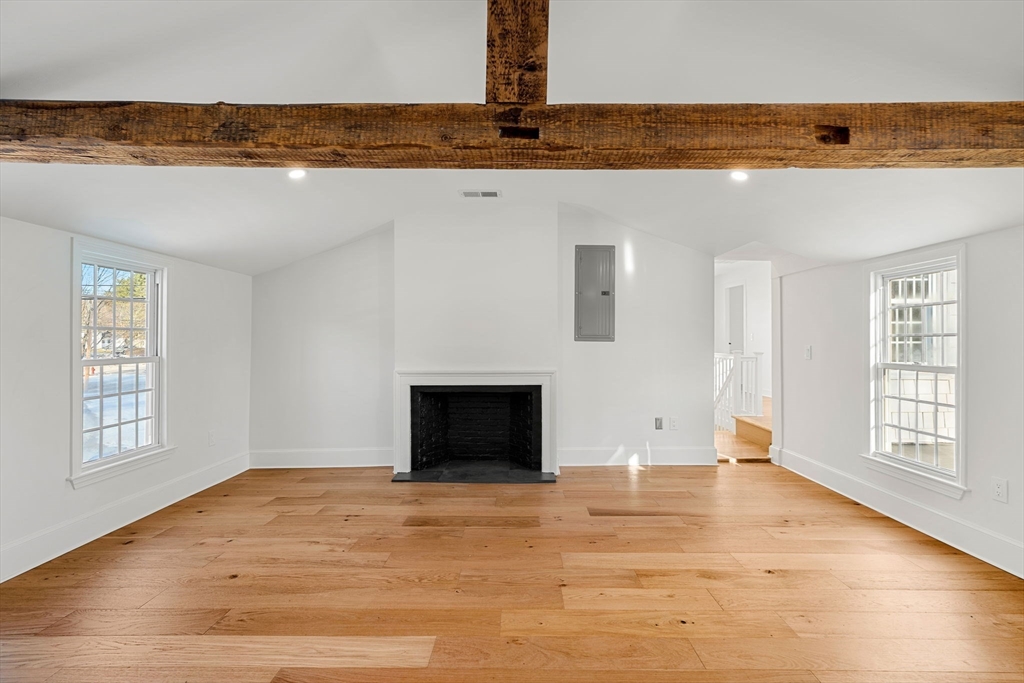 34 Central Street, Unit 2 Rowley, MA 01969 - Photo 16 of 29 a view of an empty room with window and a kitchen