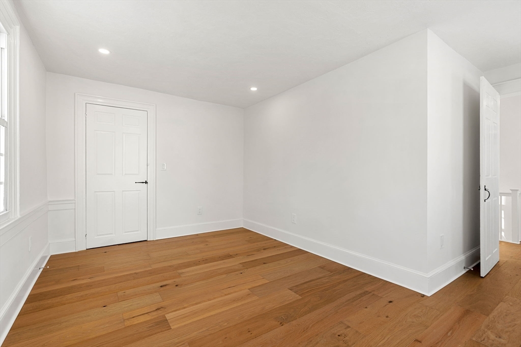 34 Central Street, Unit 2 Rowley, MA 01969 - Photo 22 of 29 a view of empty room with wooden floor