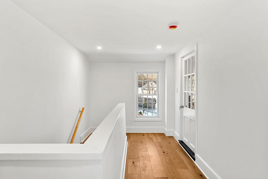 34 Central Street, Unit 2 Rowley, MA 01969 - Photo 26 of 29 a view of hallway with furniture and wooden floor