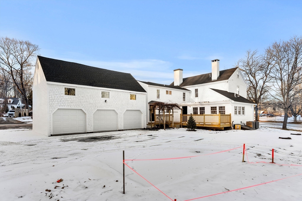 34 Central Street, Unit 2 Rowley, MA 01969 - Photo 3 of 29 a view of a building in the snow