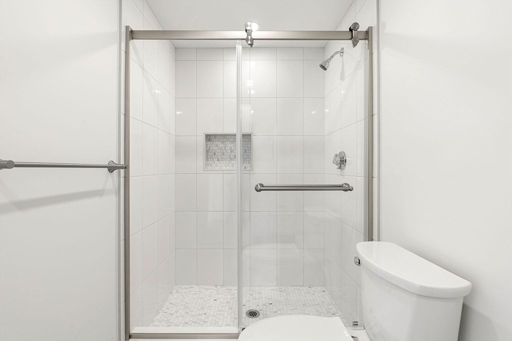 34 Central Street, Unit 2 Rowley, MA 01969 - Photo 10 of 29 a bathroom with a shower and a toilet