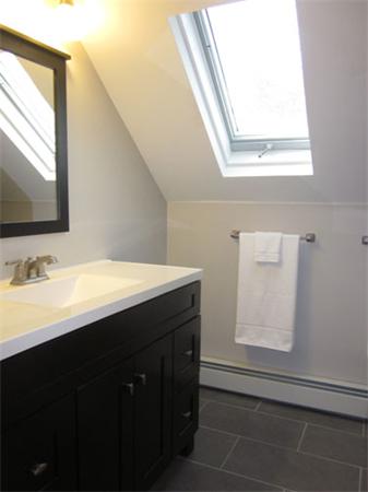 32 Davidson Road Framingham, MA 01701 - Photo 15 of 30 a bathroom with a sink and a mirror