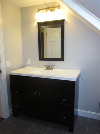 32 Davidson Road Framingham, MA 01701 - Photo 17 of 30 a bathroom with a sink and a mirror
