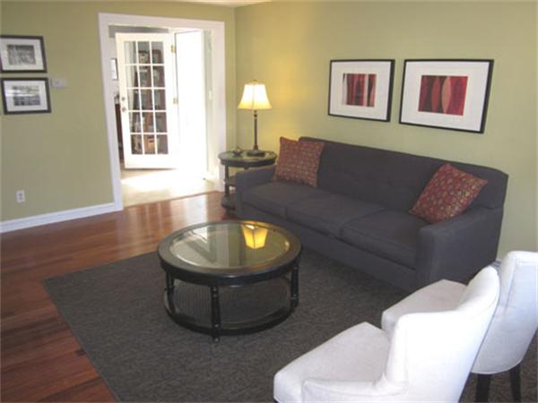 32 Davidson Road Framingham, MA 01701 - Photo 2 of 30 a living room with furniture and a lamp