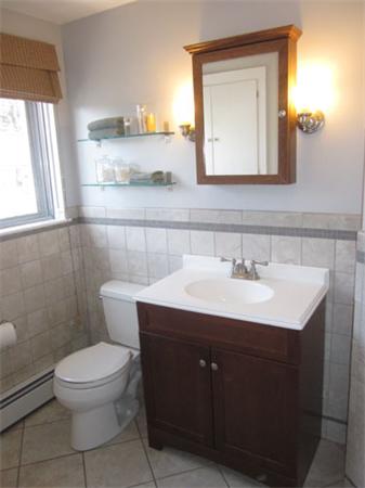 32 Davidson Road Framingham, MA 01701 - Photo 22 of 30 a bathroom with a toilet sink and mirror