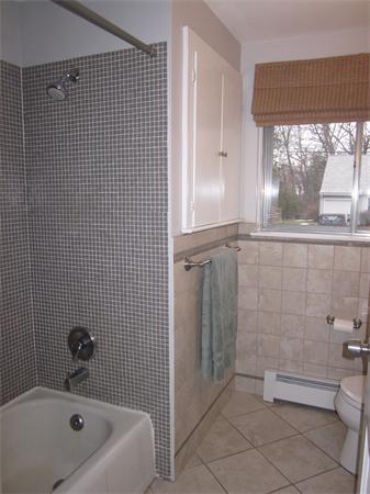 32 Davidson Road Framingham, MA 01701 - Photo 23 of 30 a bathroom with a bathtub and shower