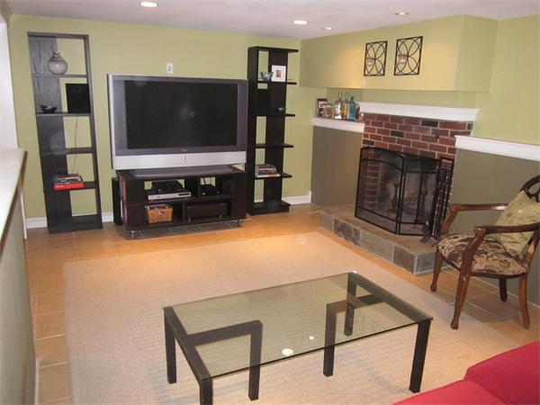 32 Davidson Road Framingham, MA 01701 - Photo 25 of 30 a room with furniture and flat screen tv