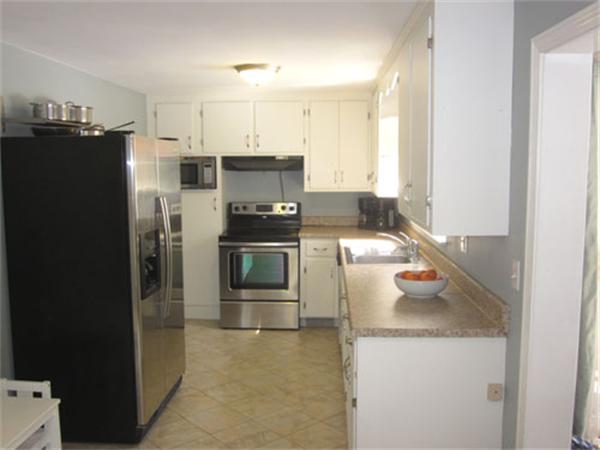 32 Davidson Road Framingham, MA 01701 - Photo 5 of 30 a kitchen with a refrigerator sink and stove