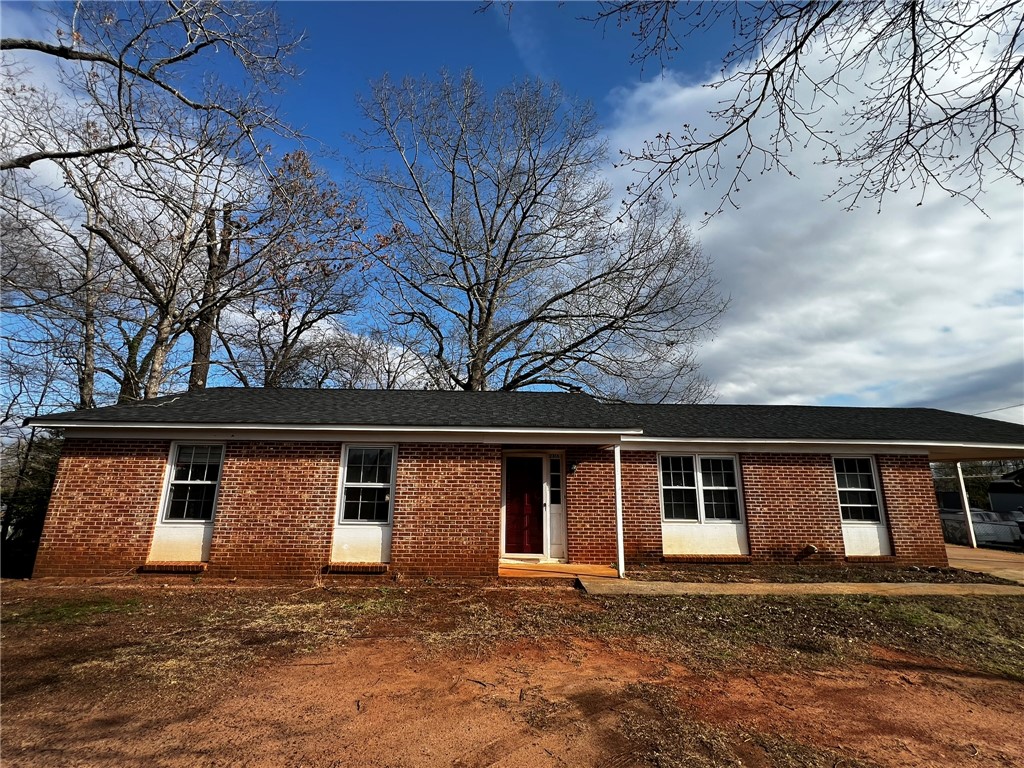 This classic brick residence presents a welcoming facade, perfect for comfortable living.