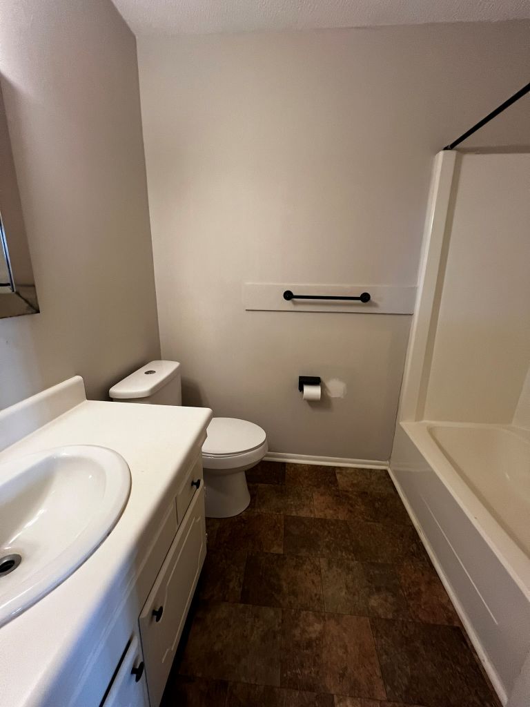 2316 Old Williamston Road Anderson, SC 29621 - Photo 2 of 10 This functional bathroom features a shower-tub combo and practical vanity.