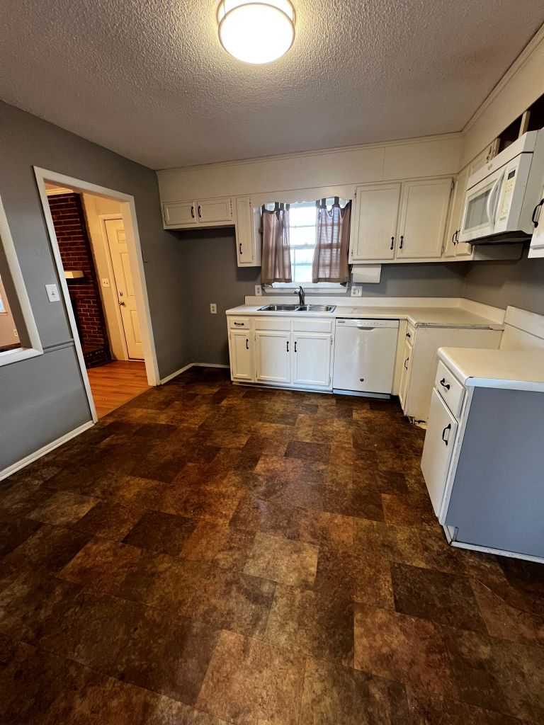 2316 Old Williamston Road Anderson, SC 29621 - Photo 6 of 10 This spacious kitchen offers ample cabinetry and an inviting atmosphere for culinary endeavors.