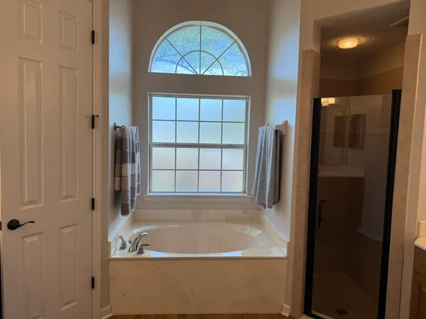 a bathroom with a sink vanity and a mirror