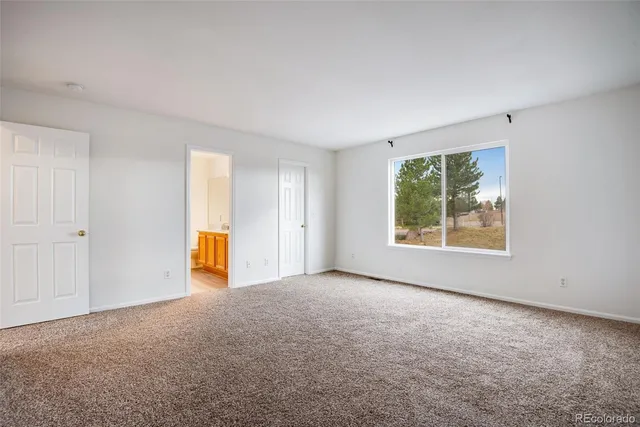 an empty room with a natural light