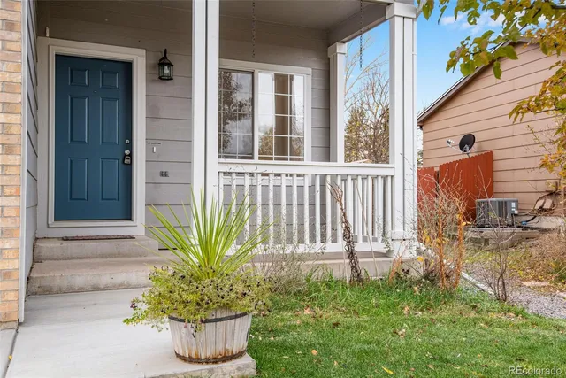 a view of a house with a small yard