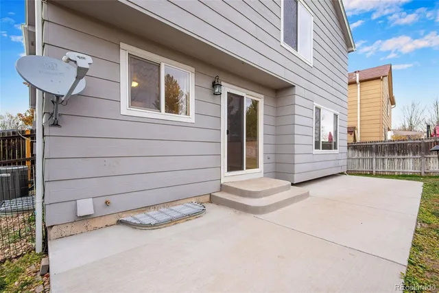 a view of a chair and table in the patio