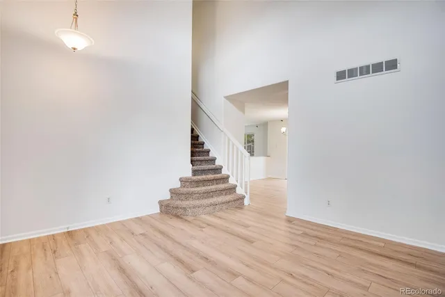 a view of entryway with wooden floor