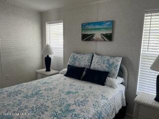 937 Laurel Circle Sebastian, FL 32976 - Photo 12 of 22 a bedroom with a bed and a window
