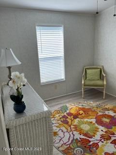 937 Laurel Circle Sebastian, FL 32976 - Photo 17 of 22 a bedroom with a bed and a chair