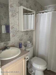 937 Laurel Circle Sebastian, FL 32976 - Photo 19 of 22 a bathroom with a sink a toilet and shower