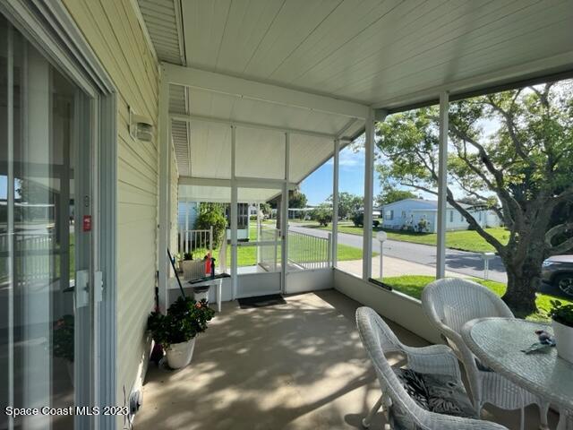 937 Laurel Circle Sebastian, FL 32976 - Photo 3 of 22 a view of a porch with furniture and a yard