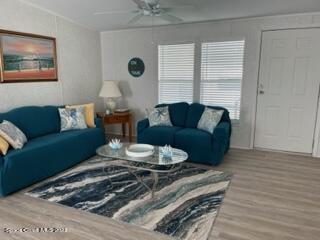 937 Laurel Circle Sebastian, FL 32976 - Photo 8 of 22 a living room with furniture and a large window
