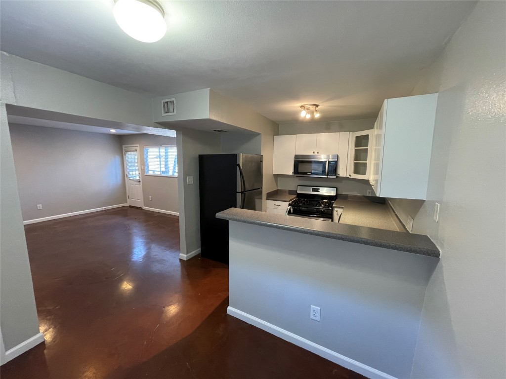 610 Franklin Boulevard, Unit B Austin, TX 78751 - Photo 4 of 14 a living room with stainless steel appliances furniture and a view of kitchen